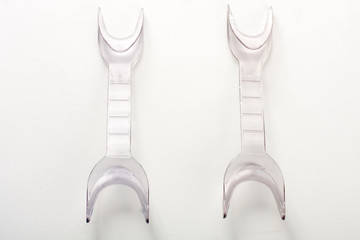 Two double ended oral retractors