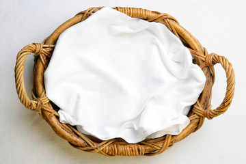 Top view on bakery basket with napkin
