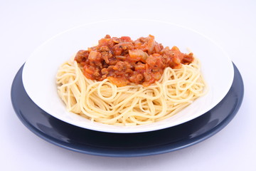 Spaghetti bolognese on a plate on a white background
