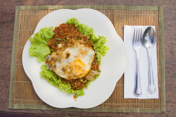 Fried egg on the food.
