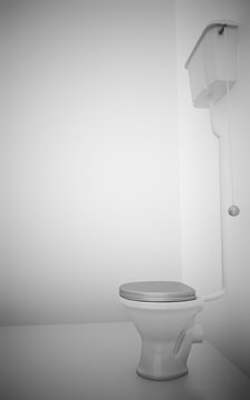 white ceramic toilet in surroundings light walls