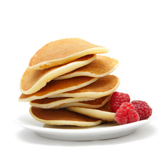 small pancakes topped with berries