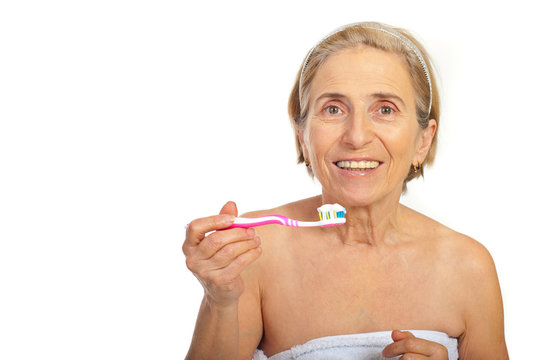 Smiling Senior Woman With Tooth Brush