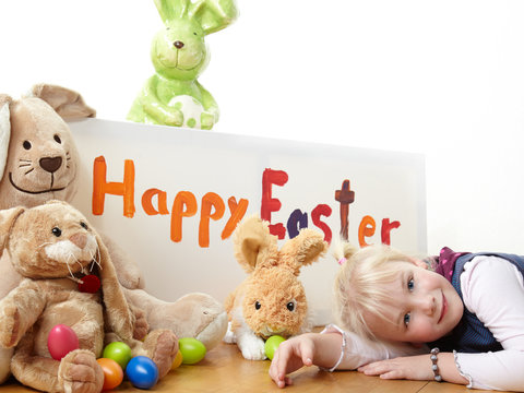 Cute blond child is waiting for Easter