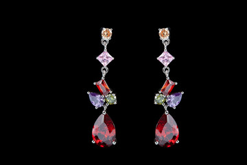 colored earrings on black