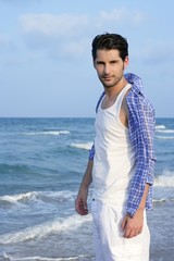 Fototapeta premium Mediterranean latin young man on beach