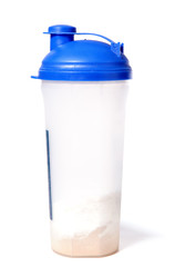 Plastic protein shaker with blue top and whey powder inside isol