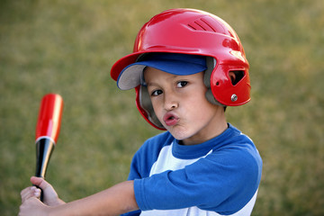 Portrait of Boy with Baseball Bat and Red Helmet