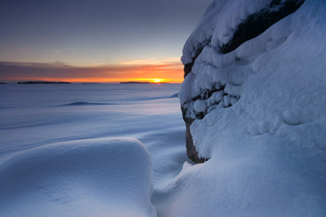Snowy beach rocks
