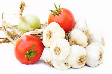 Garlic bunch with fresh organic tomatoes