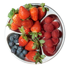 Berries in stainless steel blate shot from above, isolated