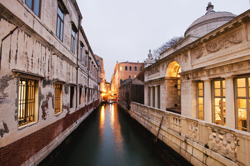 Fototapeta na wymiar Venice canal and surrounding buildings at dusk