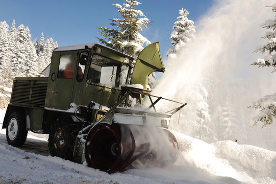 Special winter vehicle for removing snow from road in action