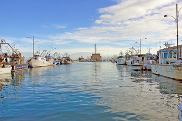 Fototapeta na wymiar Italy Ravenna marina boats in the fishing harbor