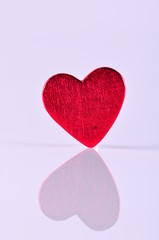 red heart on white with reflection