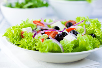 Fresh vegetable salad with feta cheese and olives