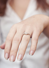 engagement ring inserted into finger