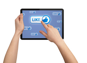 hand pressing LIKE button in tablet pc