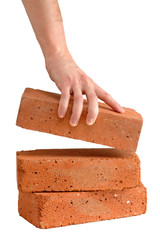 Man takes brick from the pile