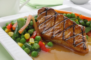 Pork meat with vegetables and sauce