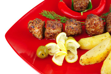 roast cutlets on red dish
