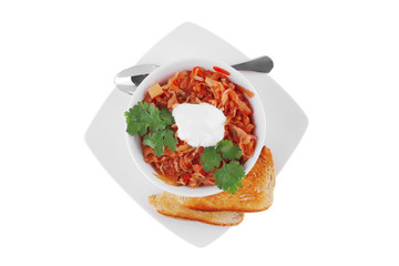 red vegetable soup in white bowl