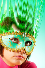 Attractive woman posing in the stylish mask