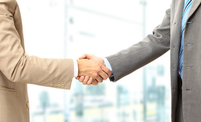 Business men hand shake in the office