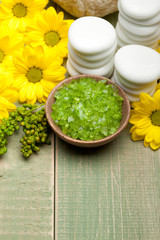 Aromatherapy - lime bath salt and yellow flowers