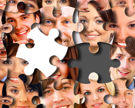 Group Of Business People In Pieces Of A Puzzle