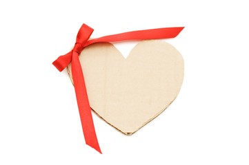 Heart from a cardboard with a bow