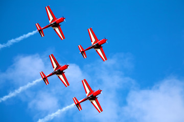 four airplanes in formation on airshow - obrazy, fototapety, plakaty