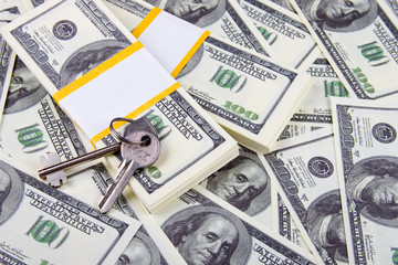 Keys of one hundred dollar bills background