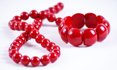 red beads and bracelet