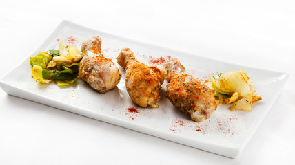 Roasted chicken drumsticks and vegetables