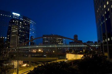 Fototapeta na wymiar Skyline of modern skyscrapers with illuminated windows
