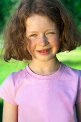 Beautiful little girl with curly hair