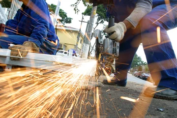 Fotobehang man at work grinding steel © Casa.da.Photo