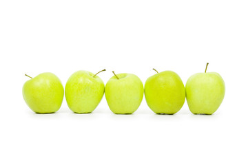 Green and yellow apples on a white baclground