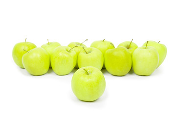 Green and yellow apples on a white baclground