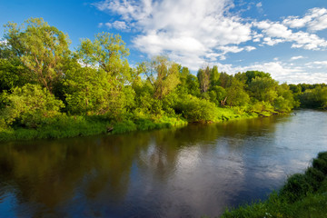 small river under blue sky.The end of summer