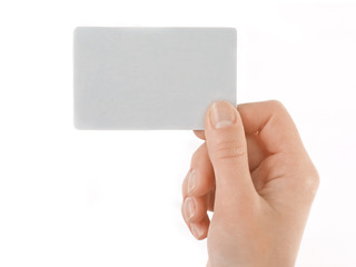 Business card in female hand. Studio isolated.