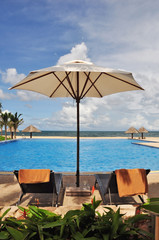 beds beside the pool