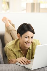 Happy woman browsing internet