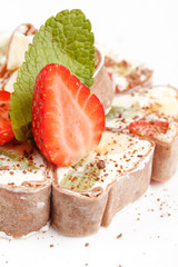 Tiramisu Sushi Roll garnished with Strawberry and Mint