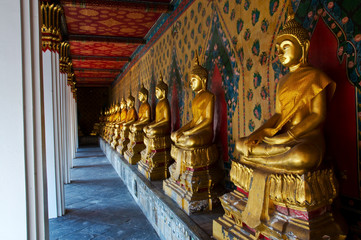 Row of Golden Buddha Statue at Temple