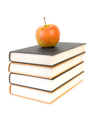 back to school: stack of books with apple on top