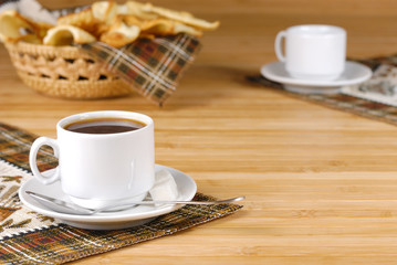 Coffee cup on the wooden table