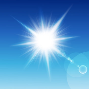 Sun with rays on a blu sky