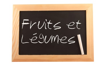 Obraz premium Fruits et légumes sur ardoise